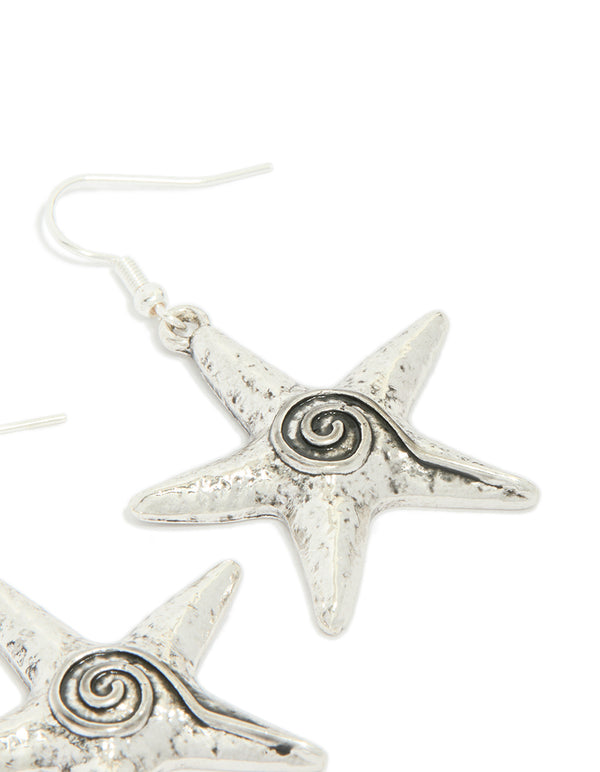 Stunning antique silver swirl starfish hook earrings showcasing ocean detailed design in a post detail view