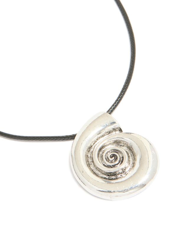 Featuring an antique silver swirl shell pendant on a black cord necklace with ocean-inspired design close up view