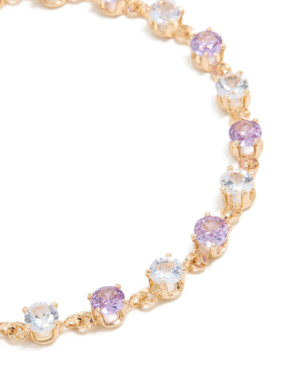 Detailed view of gold purple and grey cubic zirconia bracelet highlighting lavender and light cyan stone settings close up view