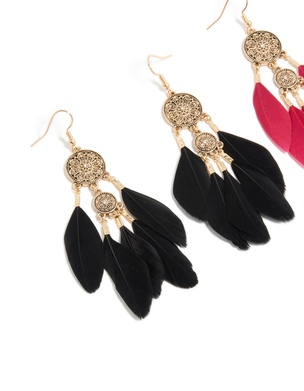 Crafted with antique gold boho drop earrings in black and pink feathers featuring close up view