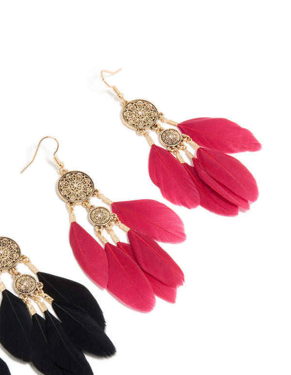 Designed with antique gold boho drop earrings featuring black and crimson feathers post detail view