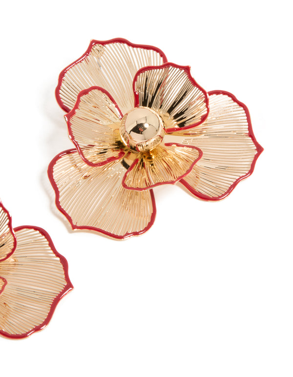 Featuring statement red outline flower stud earrings in gold with floral pattern post detail view