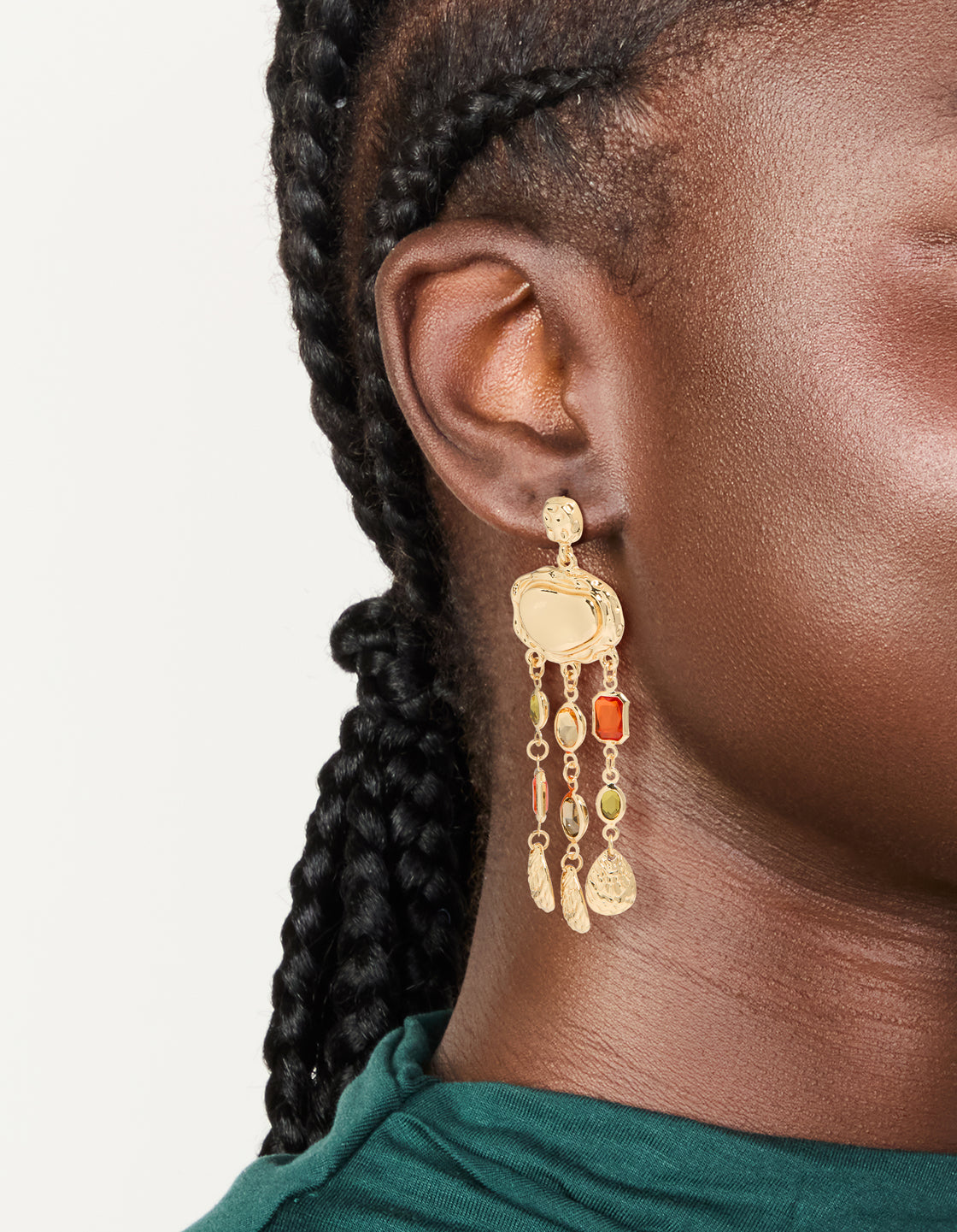 Showcasing statement drop earrings featuring charm details in a molten texture, on ear view