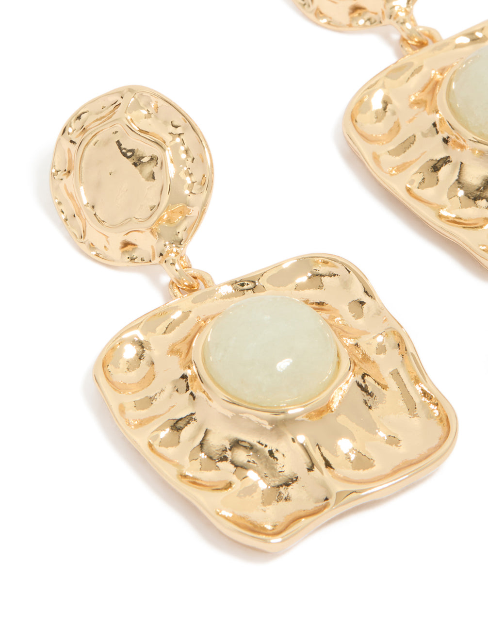 Capturing the molten texture and pale green stone detail of these gold statement square drop earrings close up view