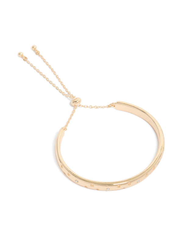 Crafted from gold celestial diamante toggle bangle front view