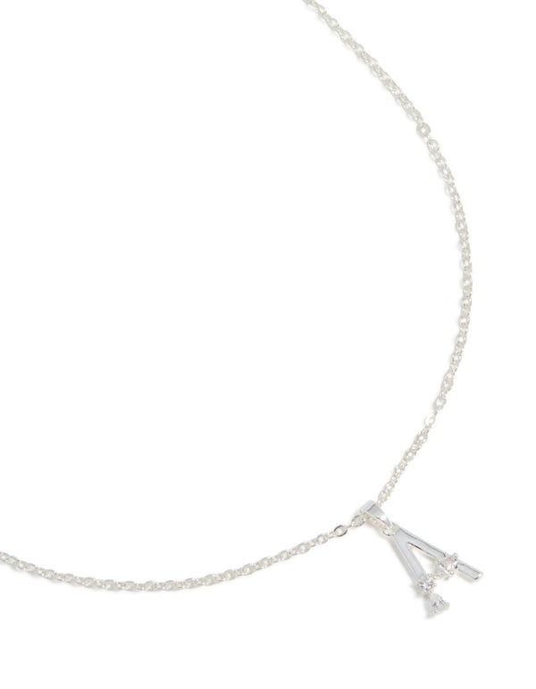 Crafted from silver plated metal, this thin letter A necklace features a pendant with cubic zirconia detailing in a statement style close up view