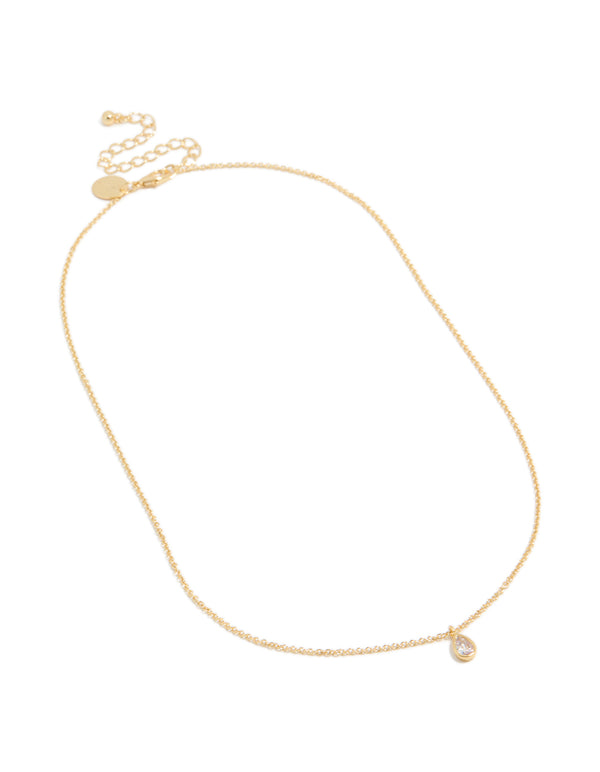 Presenting a gold plated April birthstone necklace featuring a cubic zirconia pendant in a dainty statement style, front view