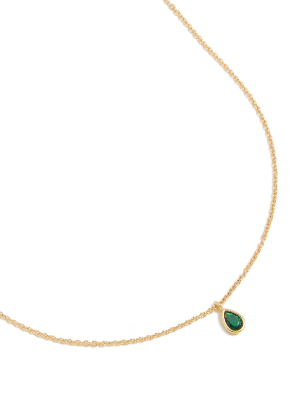 Discover a May birthstone necklace crafted from gold-plated material with emerald cubic zirconia, featuring a pendant and dainty styling, close up view