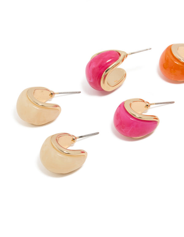 Crafted from acrylic chunky bubble hoop earrings in a 3-pack in gold, pink, and orange close up view