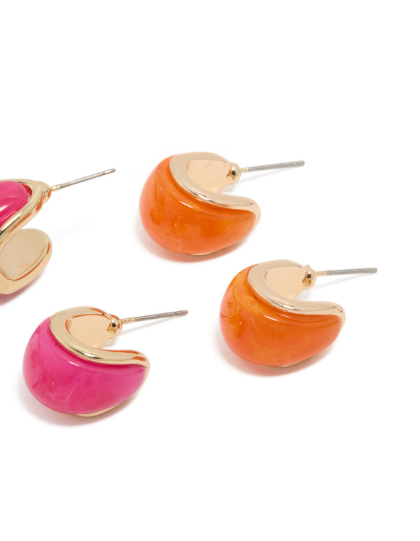 Showcasing chunky hoop earrings in a 3-pack crafted from gold, hot pink, and orange acrylic with bubble detailing post detail view