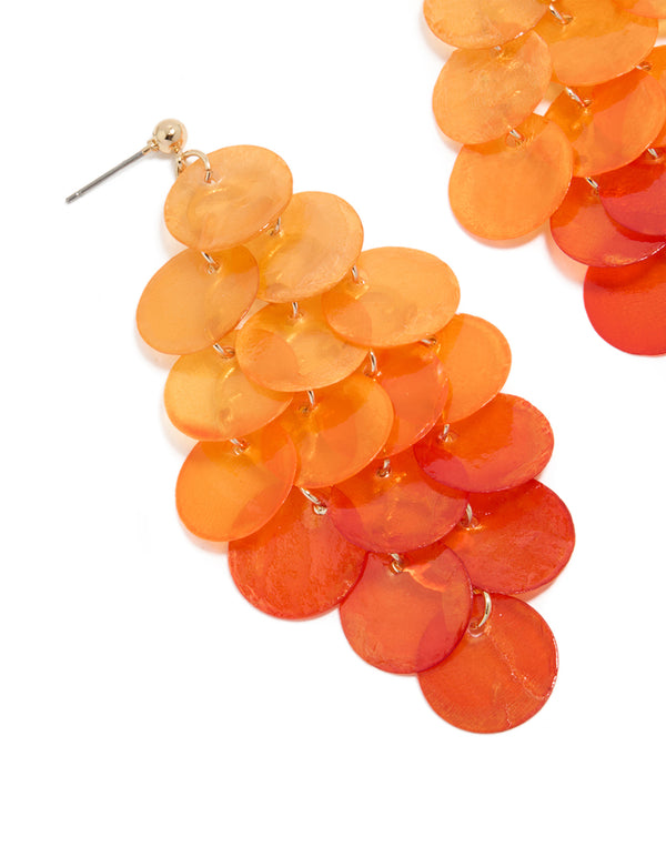 Showcasing orange genuine shell layered discs waterfall drop earrings with statement style close up view
