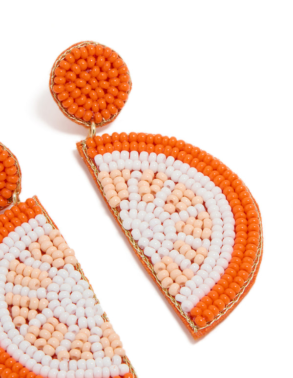 Statement drop earrings with beaded fruit detailing in orange white peachpuff and gold accents post detail view