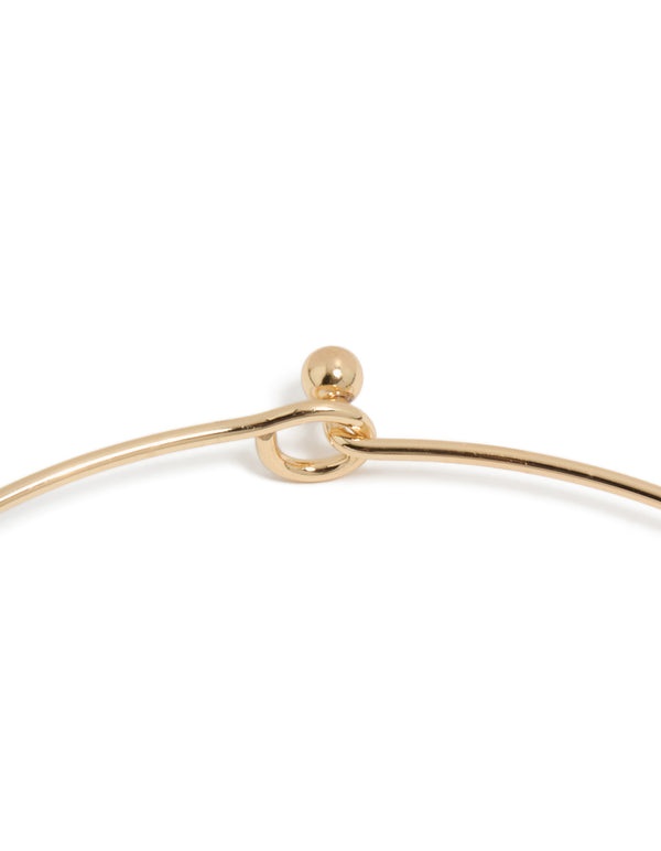 This gold orange shell disc torque necklace features statement craftsmanship clasp detail view