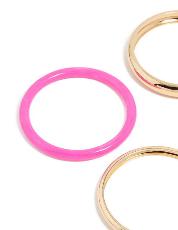 Featuring gold and mixed acrylic bangle 4-pack with hot pink band close up view
