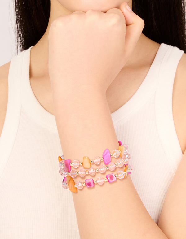 Crafted from beads in pink, brown and gold, this stretch bracelet in a 3-pack is shown on wrist view