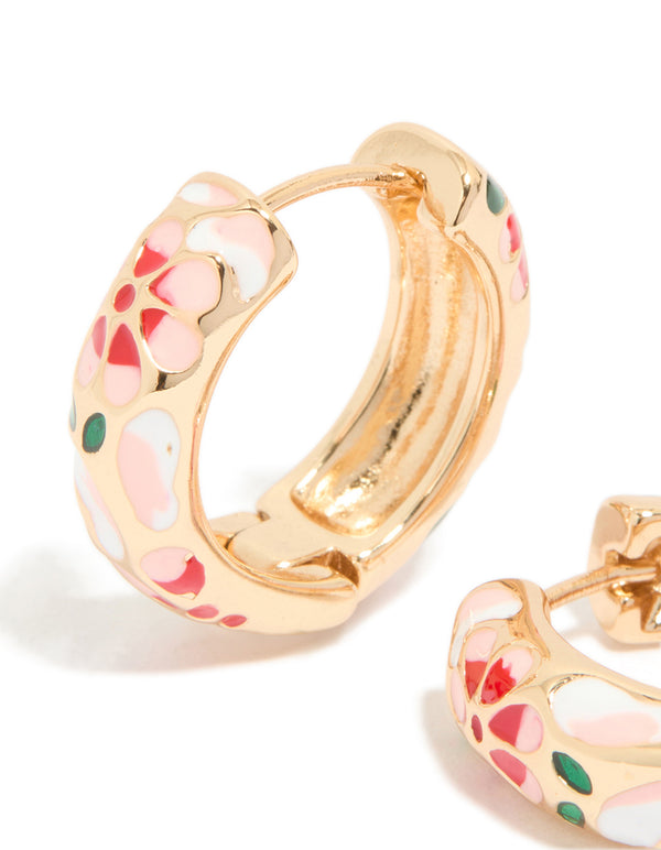 Designed with gold enamel floral thick earrings featuring chunky huggie closure and pink, red, green pattern close up view