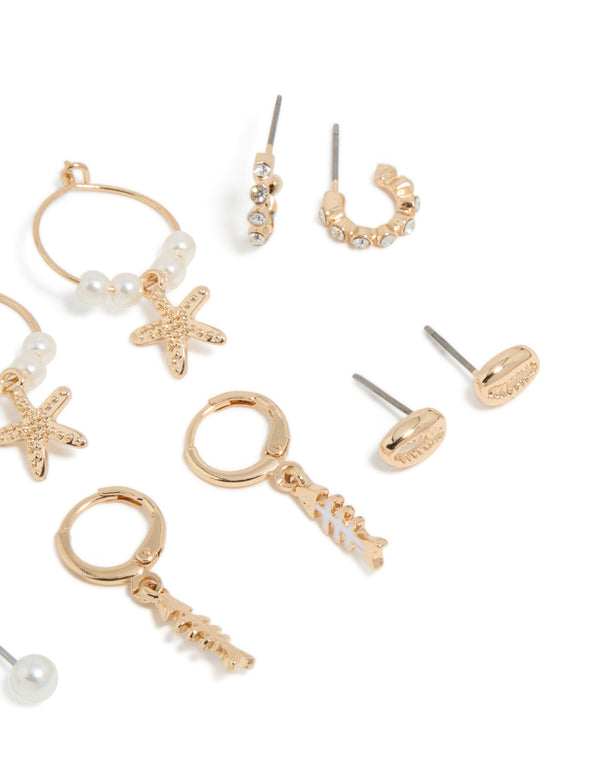 Stunning sea life huggie earrings 6-pack showcasing ocean with pearls, and shell accents in gold close up view