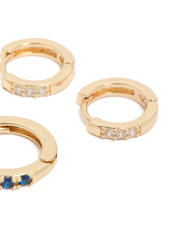 Designed with gold and featuring clear sapphire cubic zirconia stones, this 3-pack of huggie earrings offers versatile style post detail view