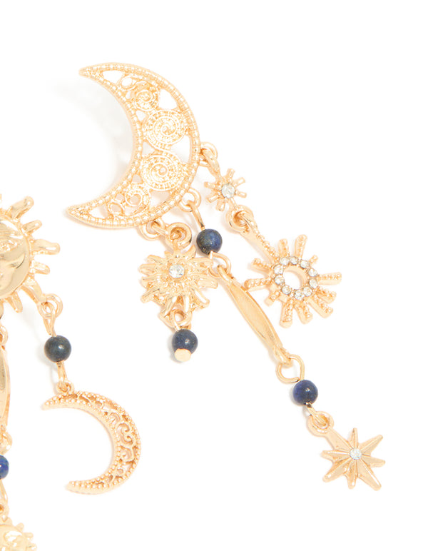 Designed with beads and celestial charms, these gold statement drop earrings highlight sun and moon elements detail view