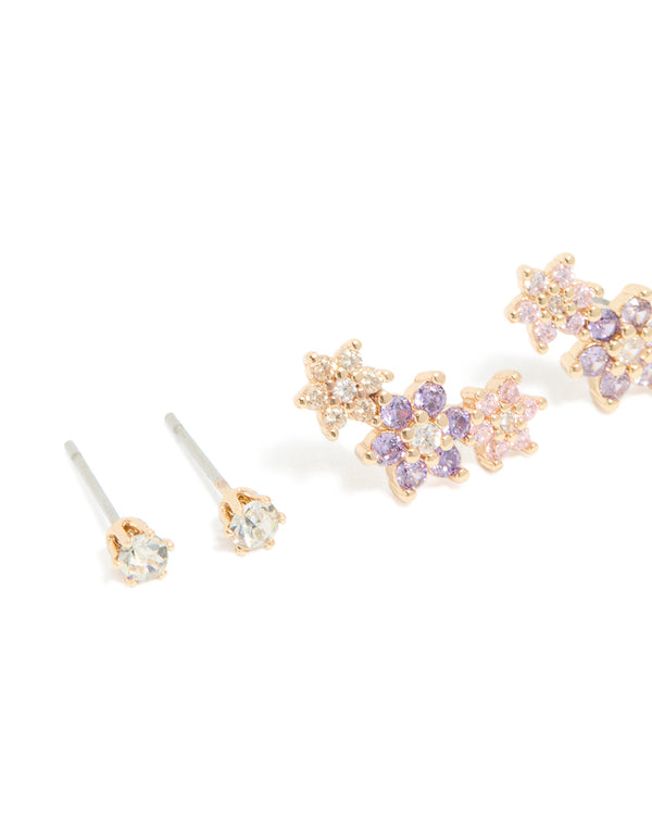 Elegant gold cubic zirconia flower stud and hoop earrings in a 3-pack with floral pattern featuring crystal materials, lavender, light pink, and silver accents close up view