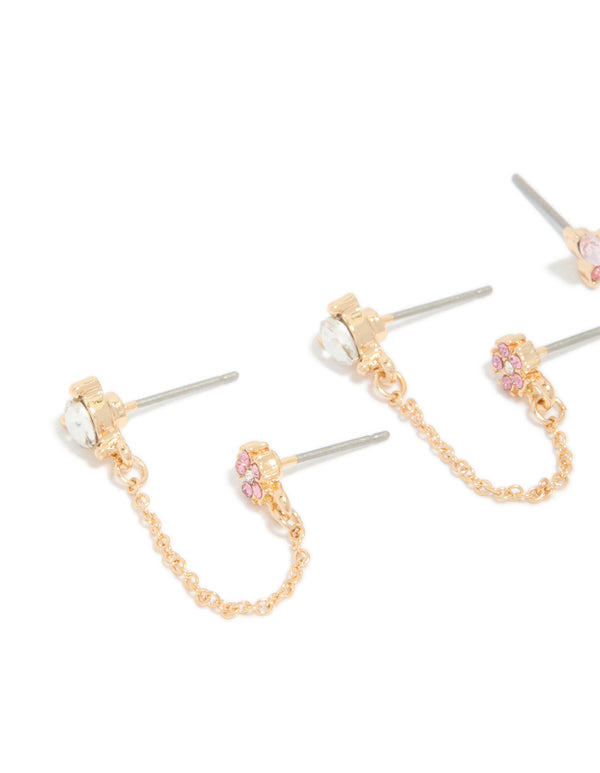 Featuring in a dainty statement style, this gold butterfly and chain earring pack features heart and floral cubic zirconia detailing in pink, lavender, and clear, close up view