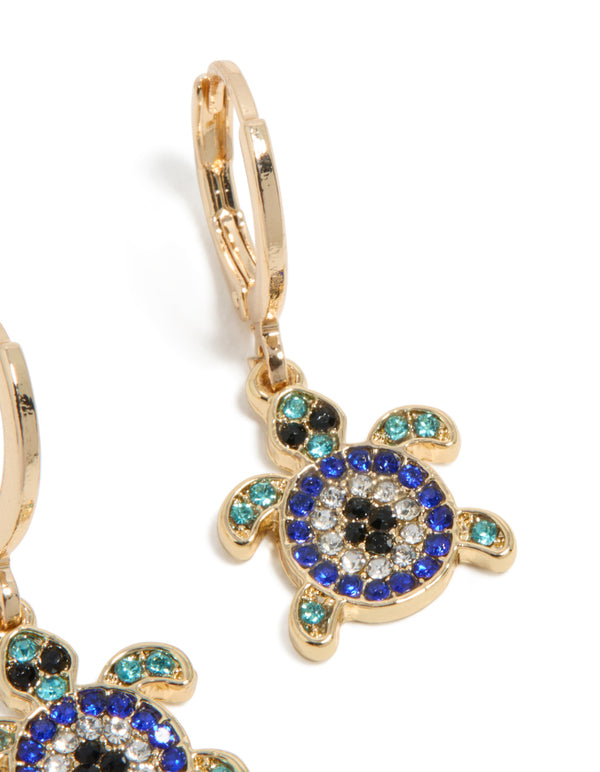 Elegant gold blue diamante turtle huggie earrings featuring ocean inspired design with turquoise and black accents in a post detail view