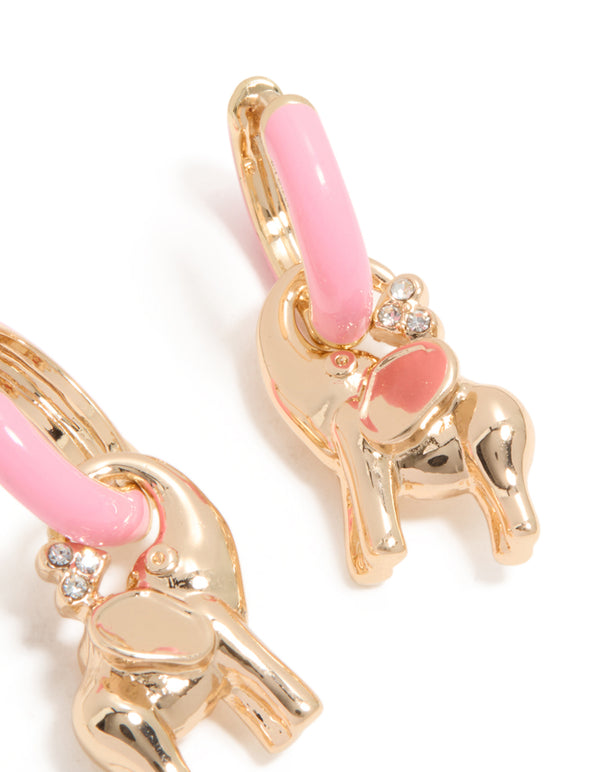 Showcasing huggie style elephant earrings crafted from enamel in light pink and gold close up view
