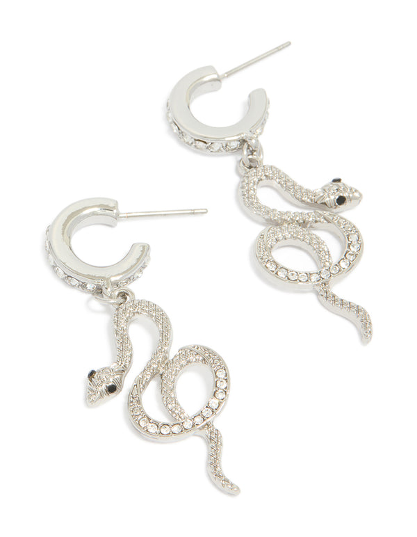 Crafted from silver, these diamante snake huggie earrings in statement style front view