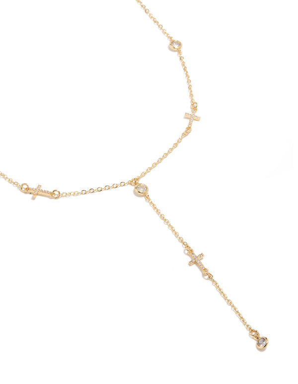 Showcasing a statement style rosary necklace crafted from bezel set cubic zirconia with a cross detail, close up view