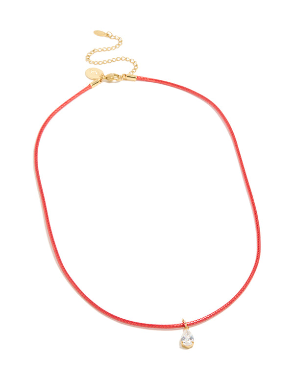 This pear cut crystal cubic zirconia waterproof gold plated stainless steel pendant necklace in red cord front view