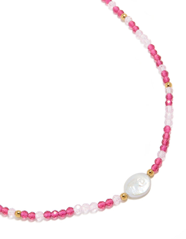 Showcasing a waterproof beaded necklace with pearl crafted from gold plated stainless steel in pink close up view