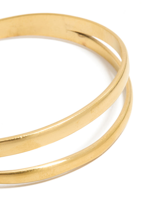 Presenting a waterproof gold plated stainless steel split double layered wrist cuff bracelet in gold close up view