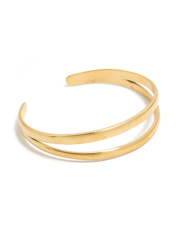 Featuring a waterproof gold plated stainless steel split double layered wrist cuff bracelet in gold front view