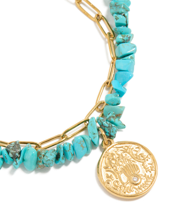 Crafted from waterproof stainless steel, these bracelet feature turquoise chip beads, coin detailing and gold plated finish close up view