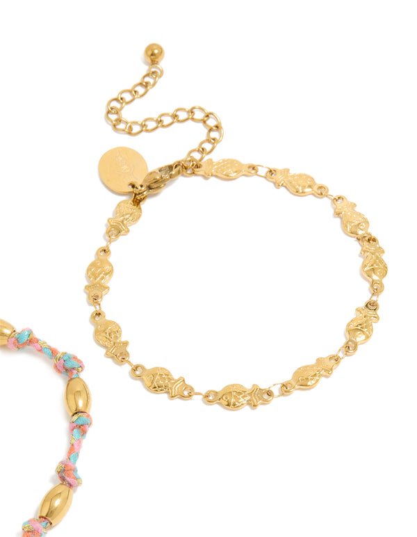 Up close waterproof bracelets in a 2-pack highlighting ocean details, crafted from stainless steel, one with beads on pink and blue cord and one in gold plated finish showing closure detail view
