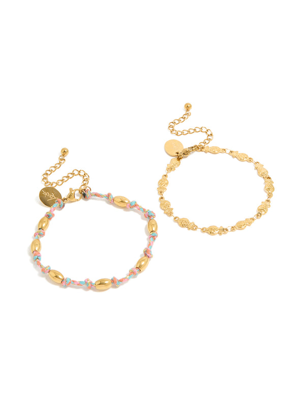 Showcasing waterproof bracelets in a 2-pack featuring ocean details, crafted from stainless steel, one with beads on pink and blue cord and one in gold plated finish front view