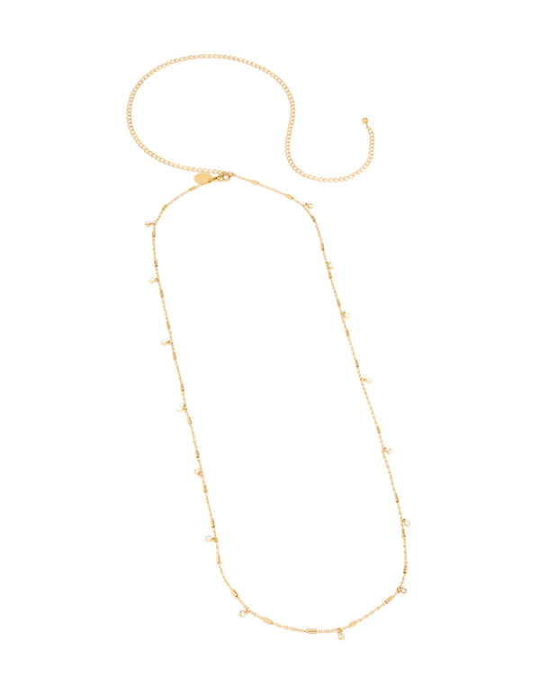 Showcasing a waterproof body chain charm details, made from gold plated stainless steel and cubic zirconia in a dainty design front view