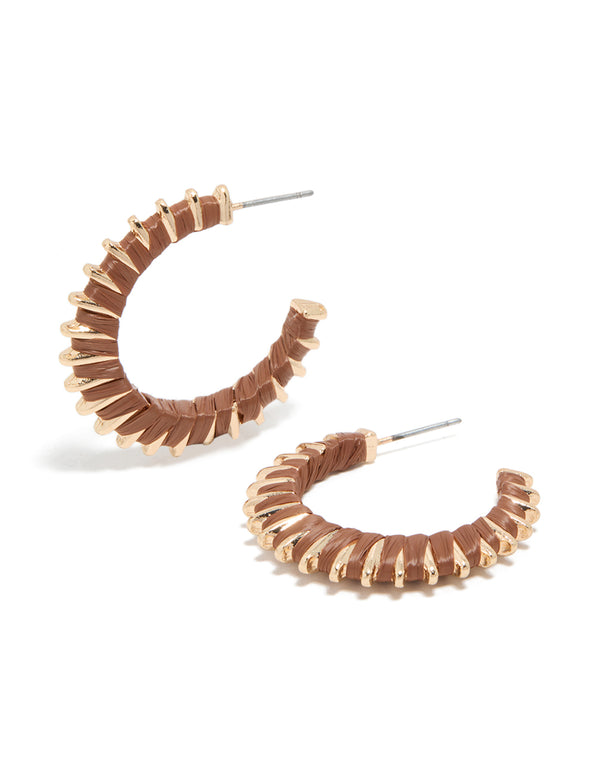 Featuring textured lined brown hoop earrings with gold closure front view