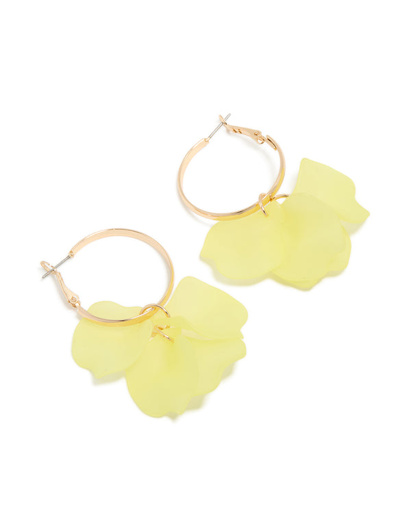 Showcasing statement hoop earrings featuring charm with floral pattern in yellow and gold tones front view