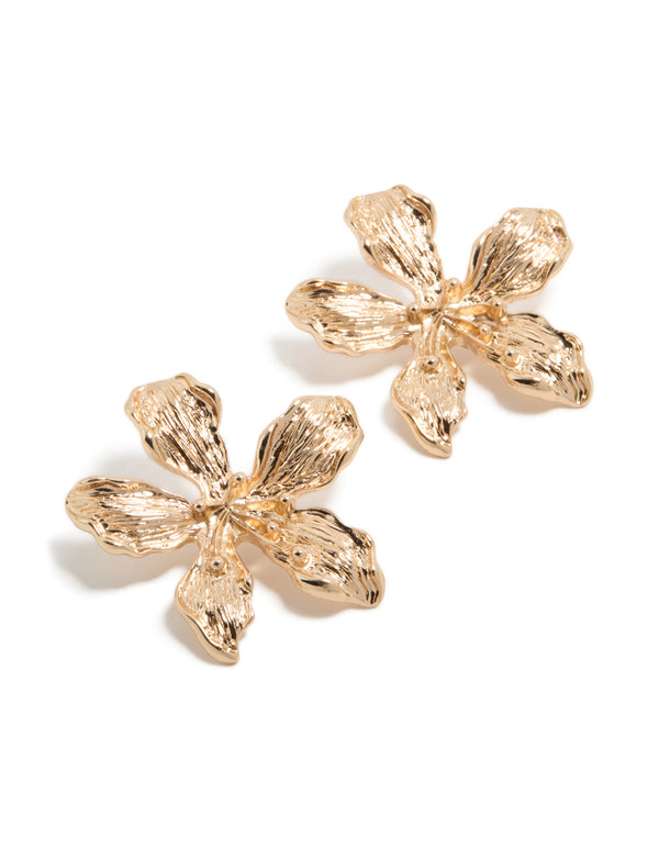 Showcasing statement stud earrings with floral design in gold front view