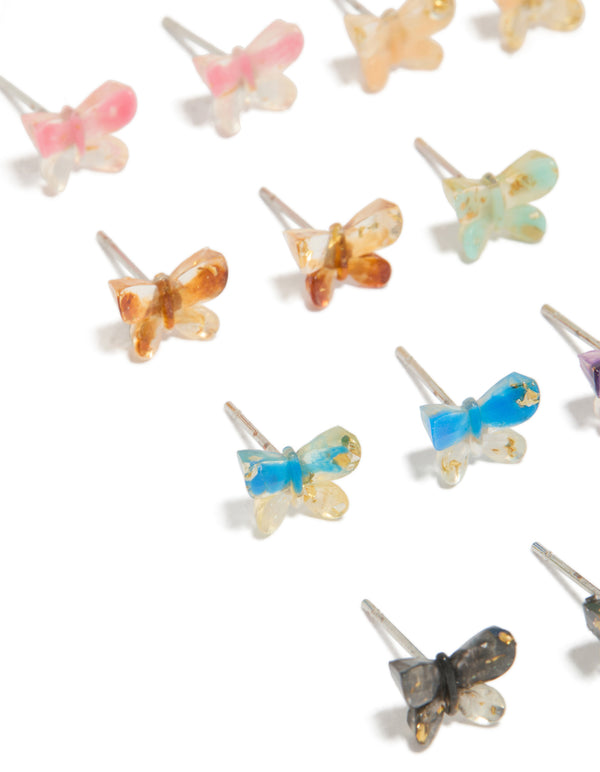 Featuring statement stud earrings in a multicoloured acrylic 8-pack with butterfly and glitter accents close up view