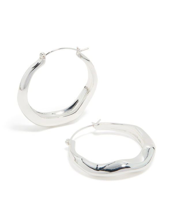 Featuring silver plated large hoop earrings front view
