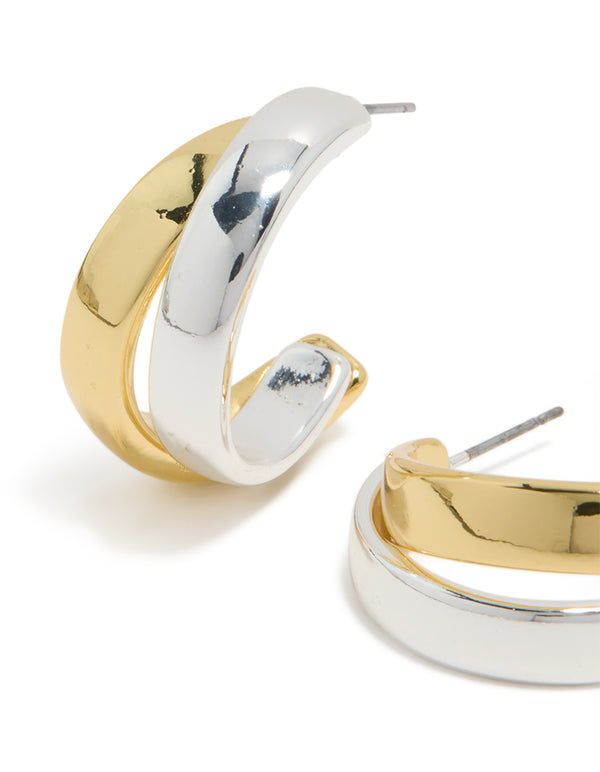 Designed with mixed metal plated layered medium hoop earrings in gold and silver close up view