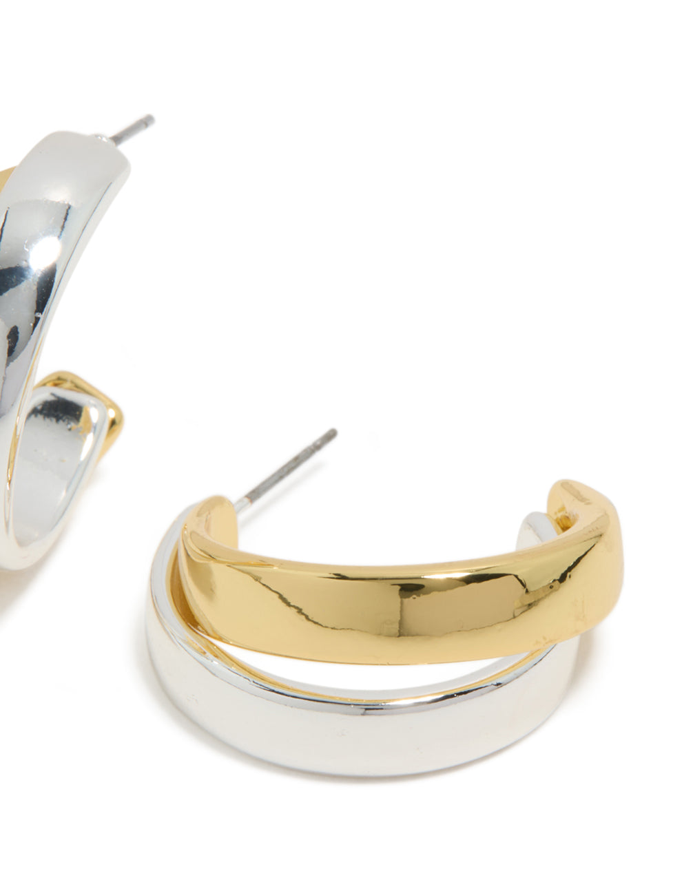 Highlighting mixed metal plated layered medium hoop earrings with gold and silver post detail view