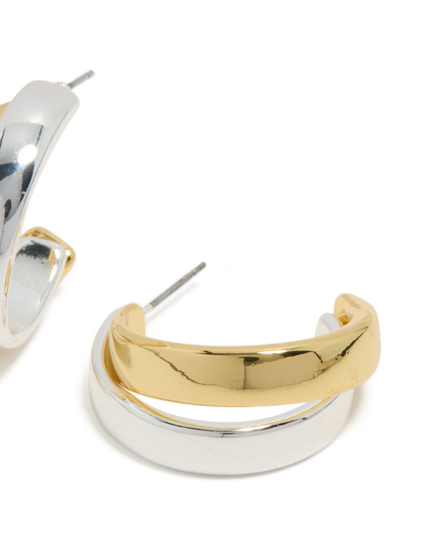 Highlighting mixed metal plated layered medium hoop earrings with gold and silver post detail view