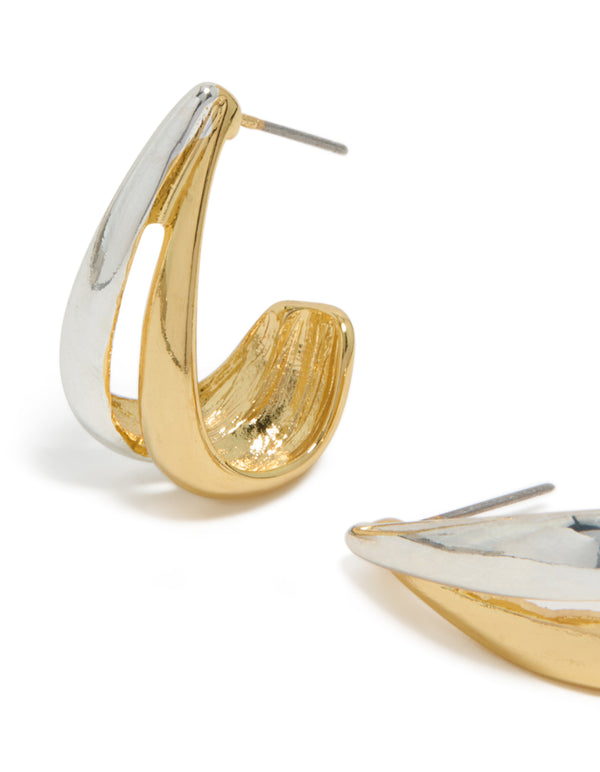 Crafted from mixed metal plated materials, these layered small hoop earrings showcase gold and silver close up view