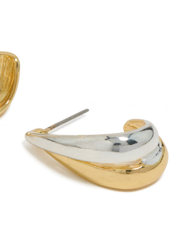 Featuring mixed metal plated layered small hoop earrings with gold and silver post detail view