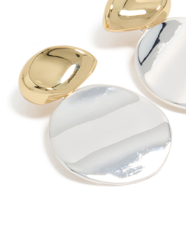 Crafted from mixed metal plated statement disc drop earrings in gold and silver close up view