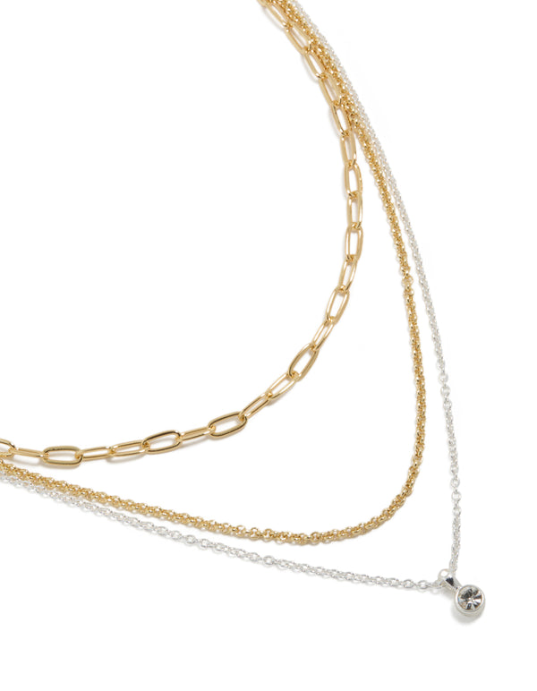 Presenting a mixed metal layered necklace with paperclip chain, diamante accents in gold and silver plated finish close up view
