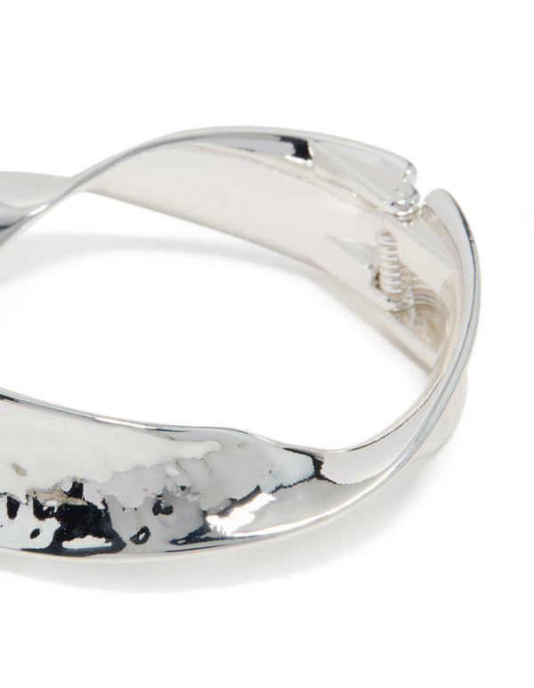 Featuring a silver plated hammered twist hinged bangle close up view